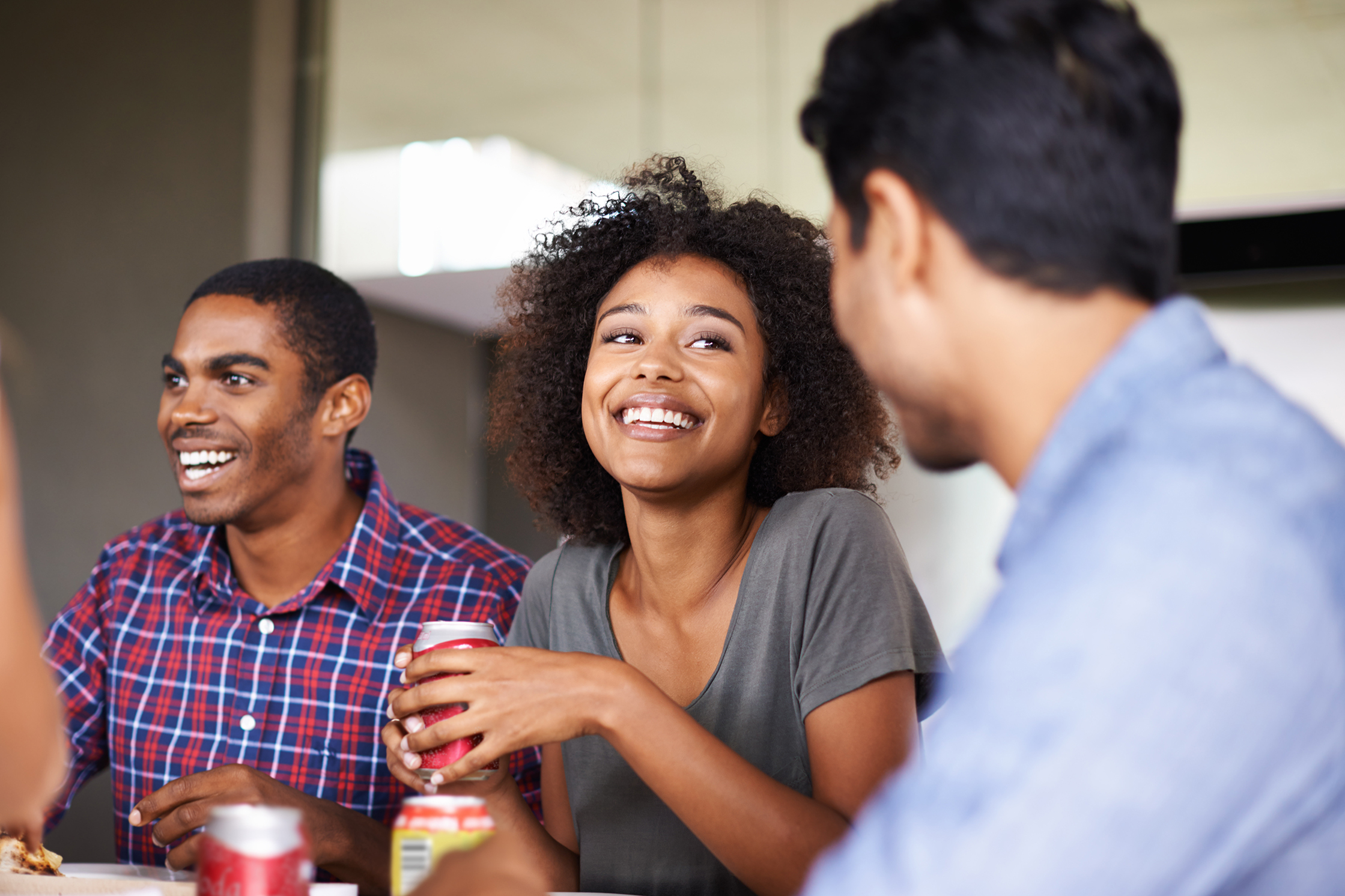 People enjoying sodas and talking
