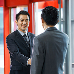 New employee shaking hands with recruiter