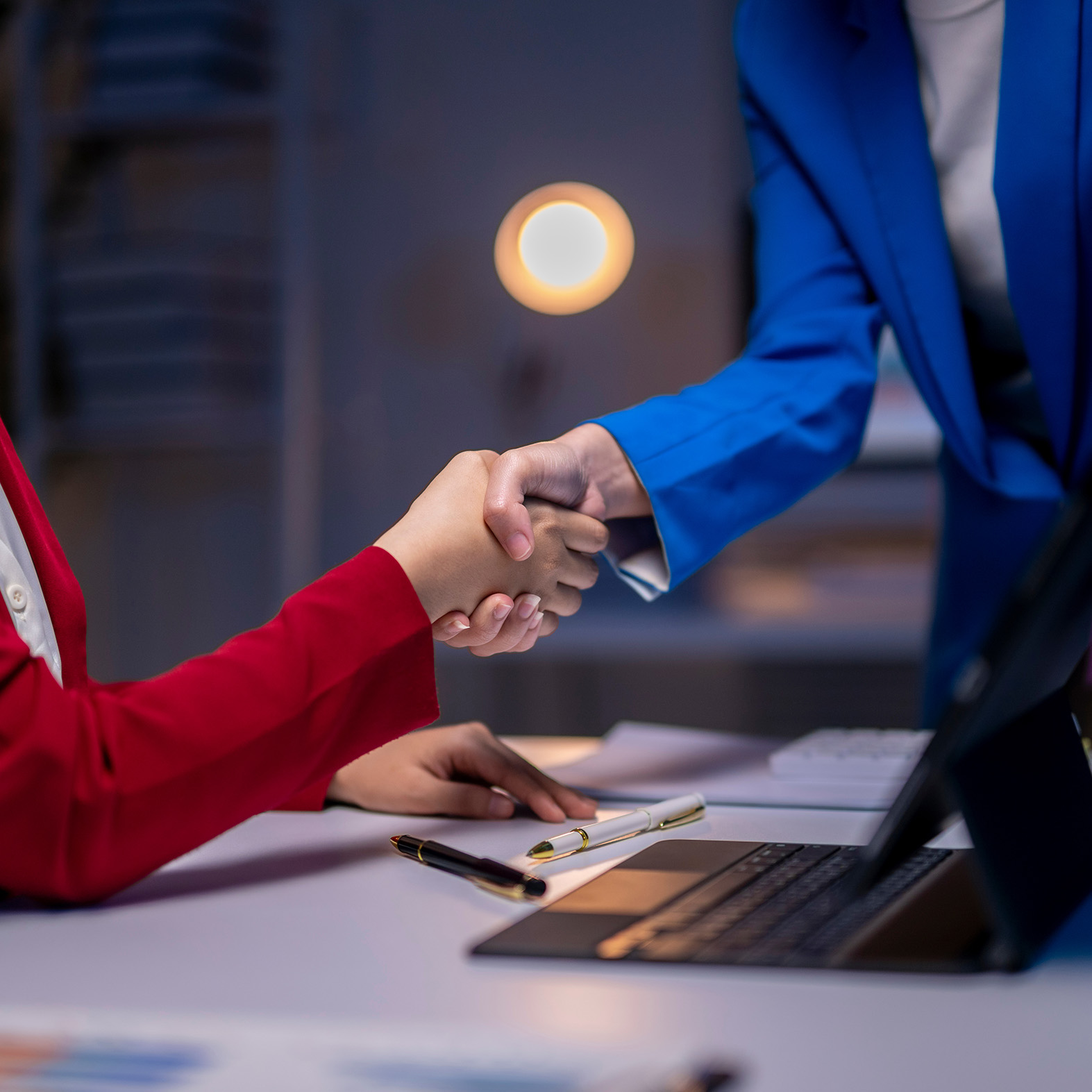 Two people shaking hands.