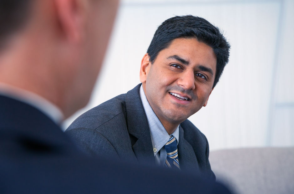 Dave-Rengachary-candid Executive leans forward in a candid conversation