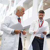 Two doctors walking and talking