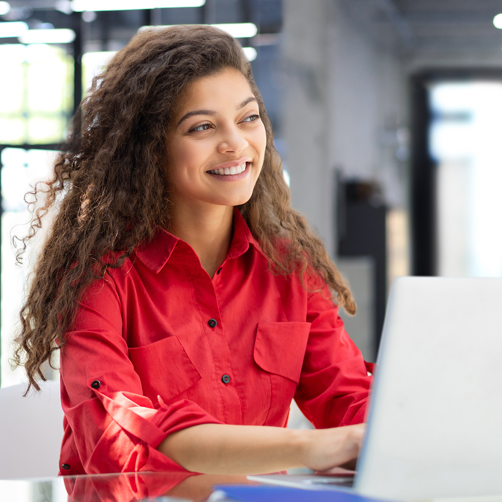 Smiling woman on her computer