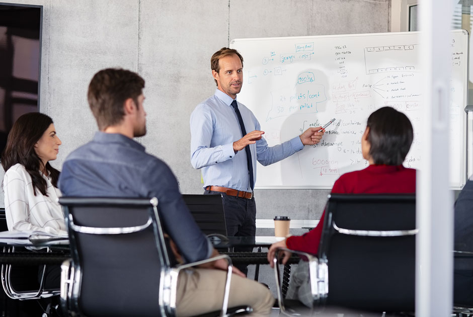 A businessman leads a group discussion