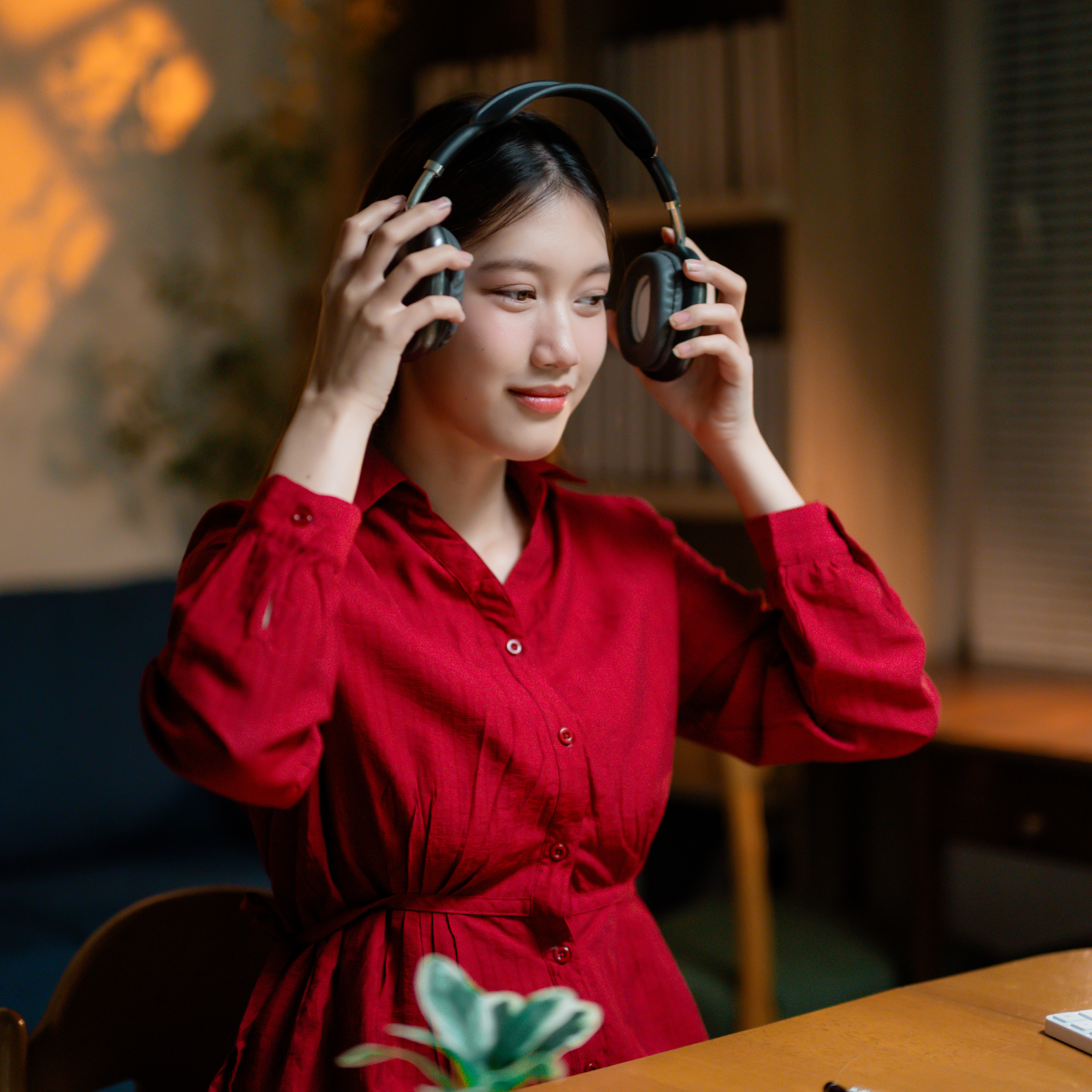 Woman putting on headphones.