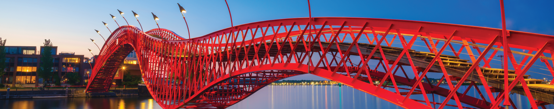 A red bridge transverses a valley, symbolizing AURA Next as the bridge to digital underwriting transformation